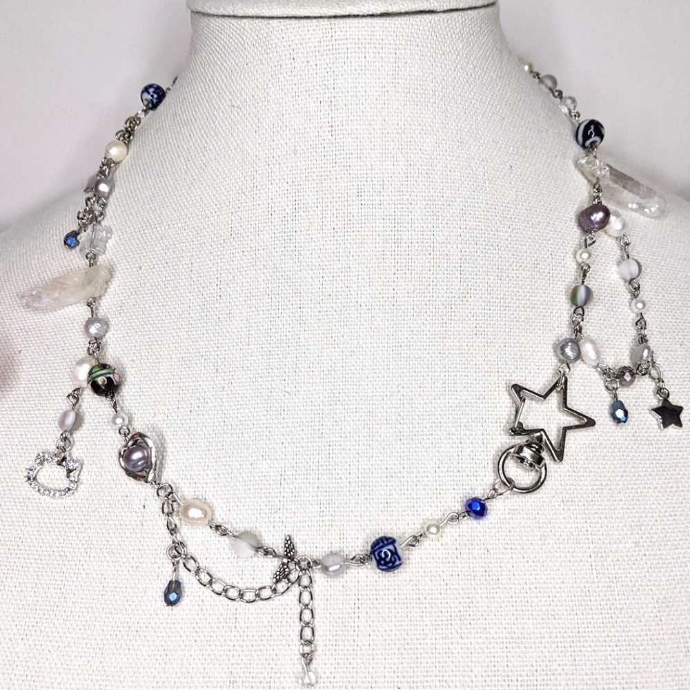 Star necklace with blue beads chain and charms. Handmade by me.